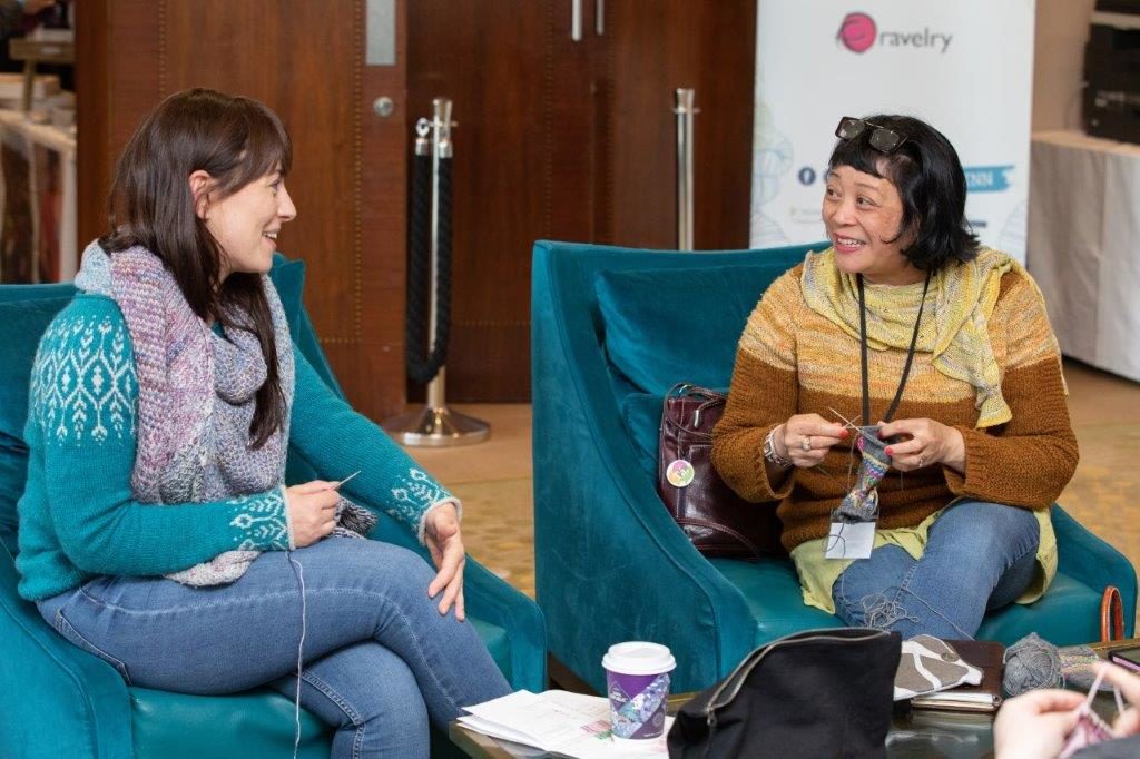 knitters sitting and knitting together at woollinn yarn festival 